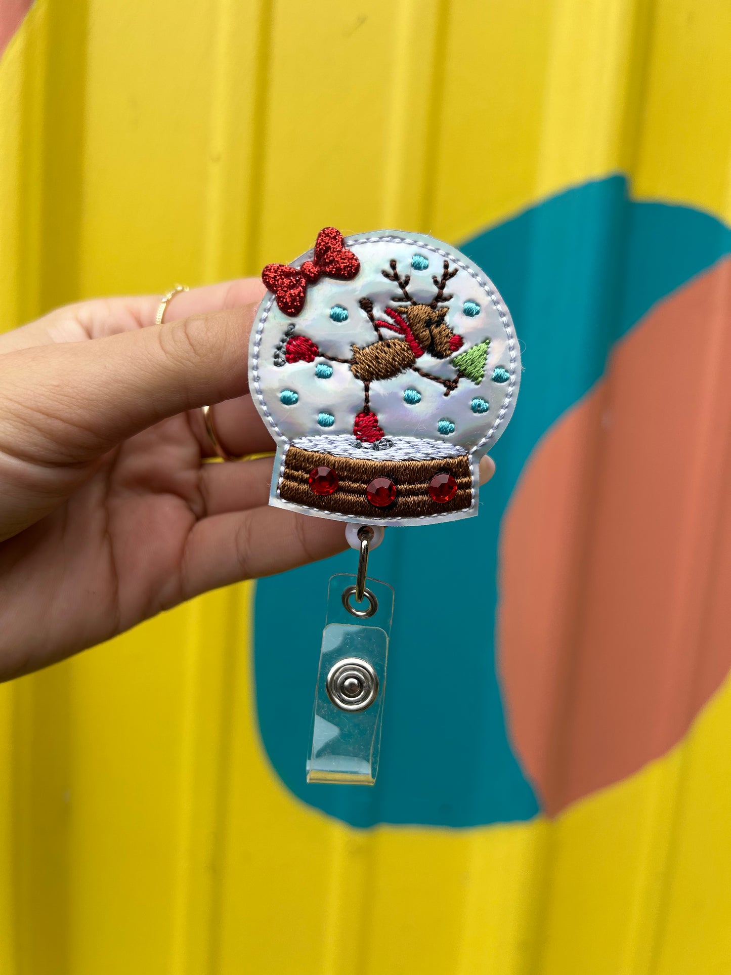 Reindeer Snow Globe Badge Reel